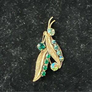 Made in Australia, vintage gold tone leaf w/ green stones Brooch
